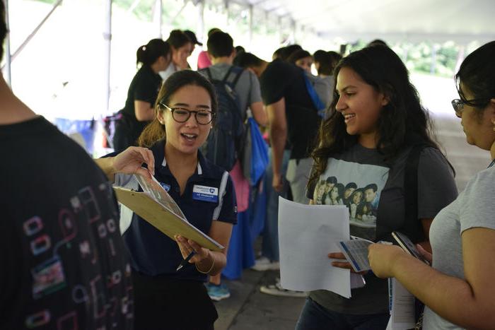 student talking to a staff member 